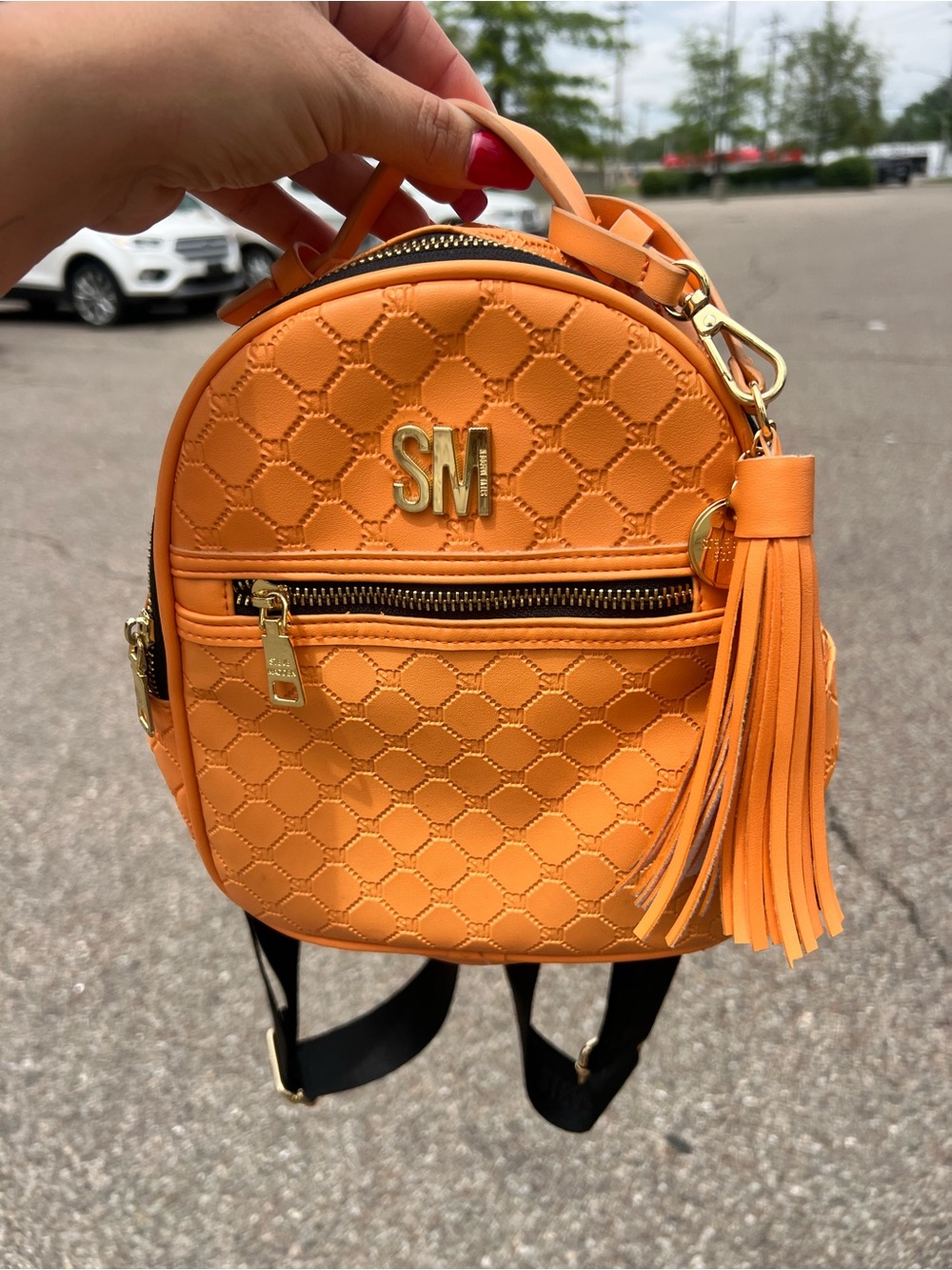 Steve Madden Orange Quilted Mini Backpack with Tassel